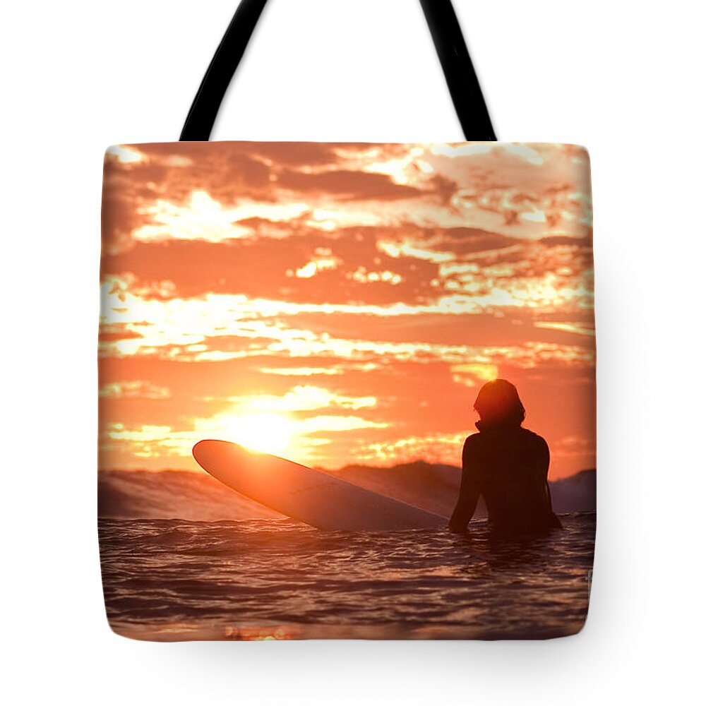 Surfing Tote Bag featuring the photograph Sunset Surf Session by Paul Topp