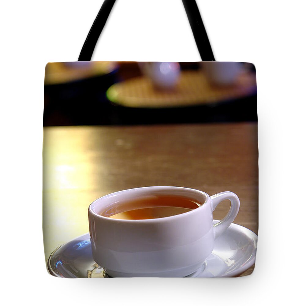 Tea Tote Bag featuring the photograph Tea at the Shop by Olivier Le Queinec