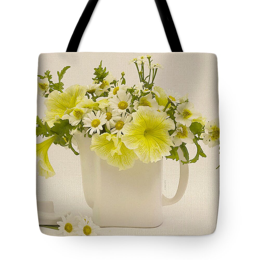 Teapot Art Tote Bag featuring the photograph Teapot of Yellow Petunias And Daisies by Sandra Foster