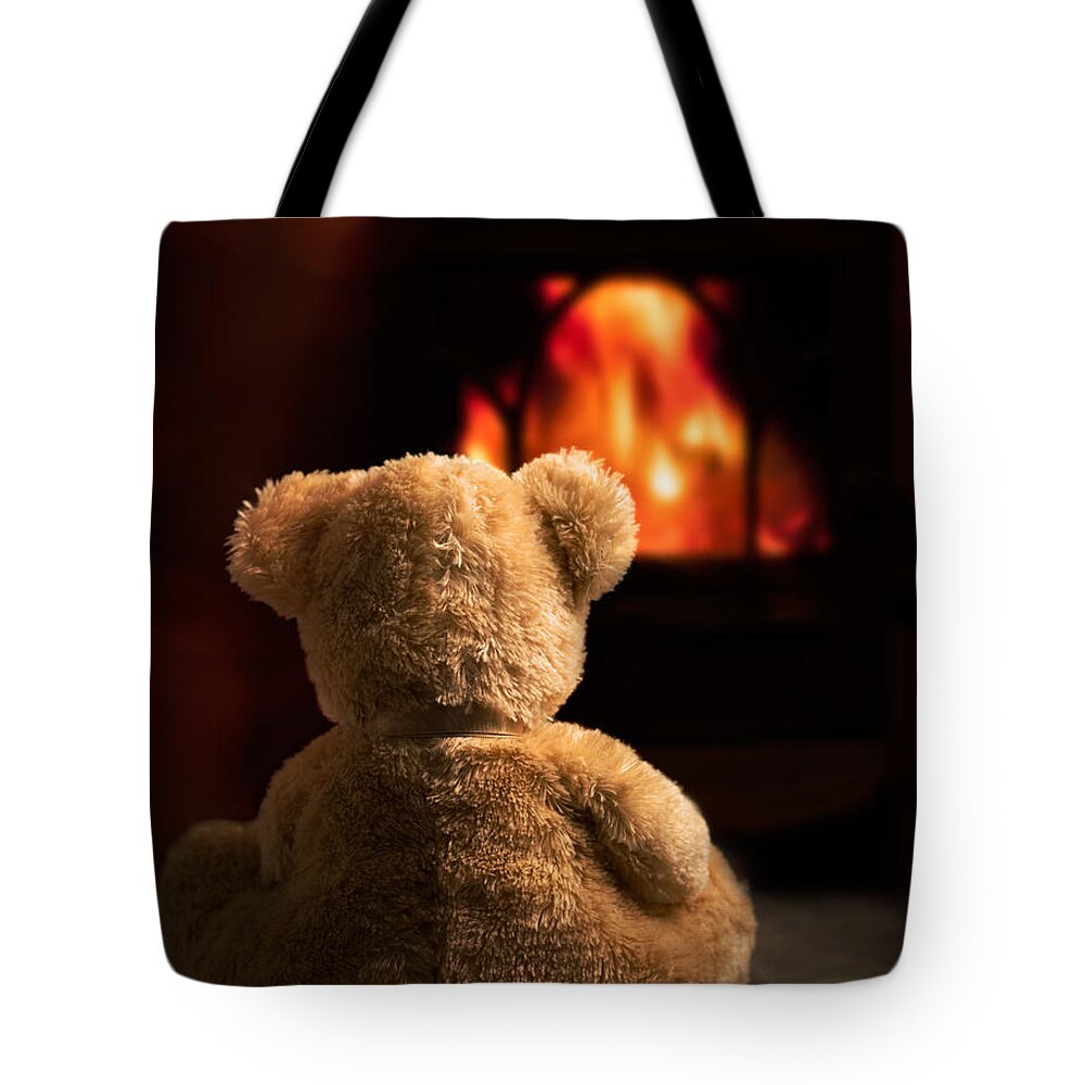 Teddy Bear Tote Bag featuring the photograph Teddy By The Fire by Amanda Elwell