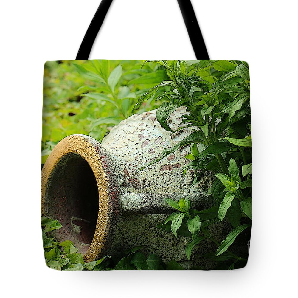 Nature Tote Bag featuring the photograph Terracotta vase in the green by Amanda Mohler