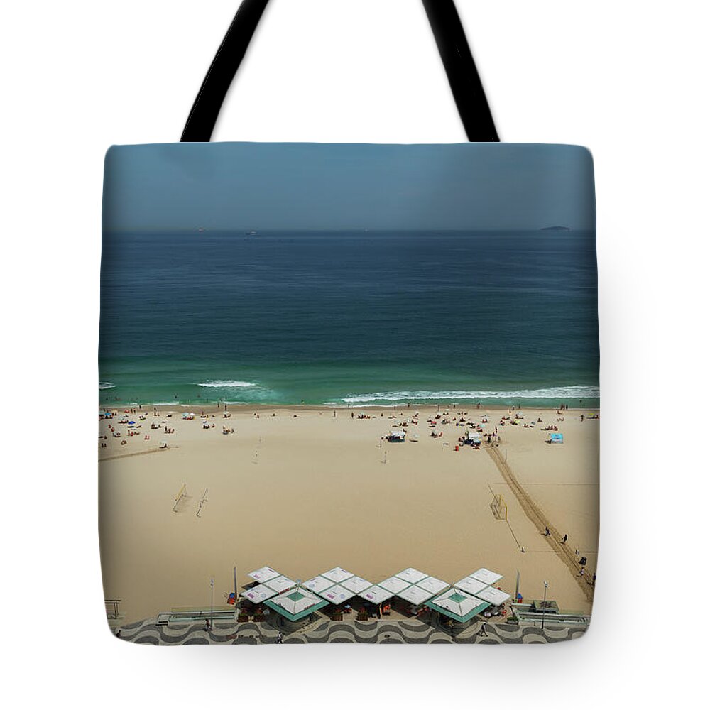 Copacabana Tote Bag featuring the photograph The Beach Of Copacabana.rio De Janeiro by Buena Vista Images