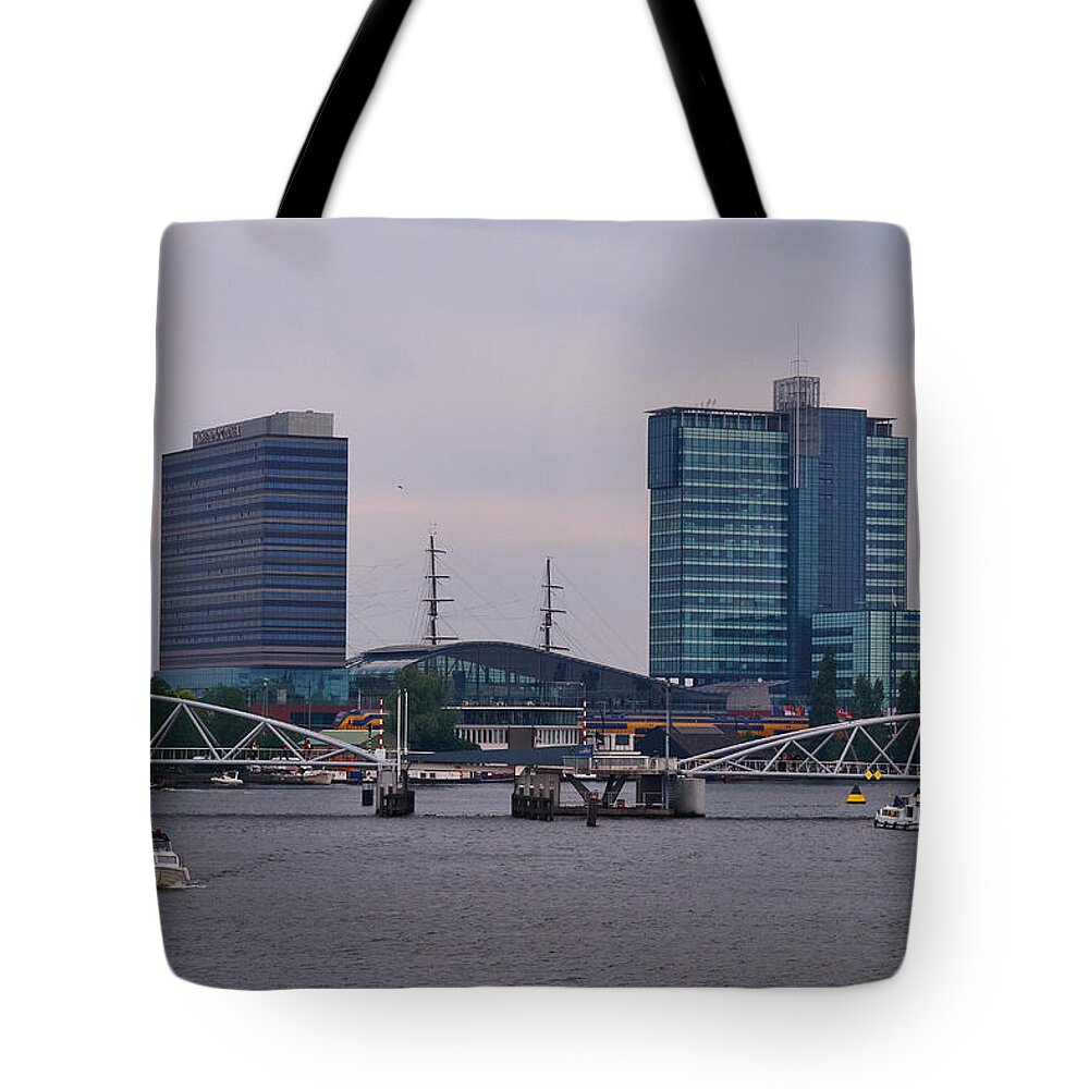 Alankomaat Tote Bag featuring the photograph The Bridge in Amsterdam by Jouko Lehto