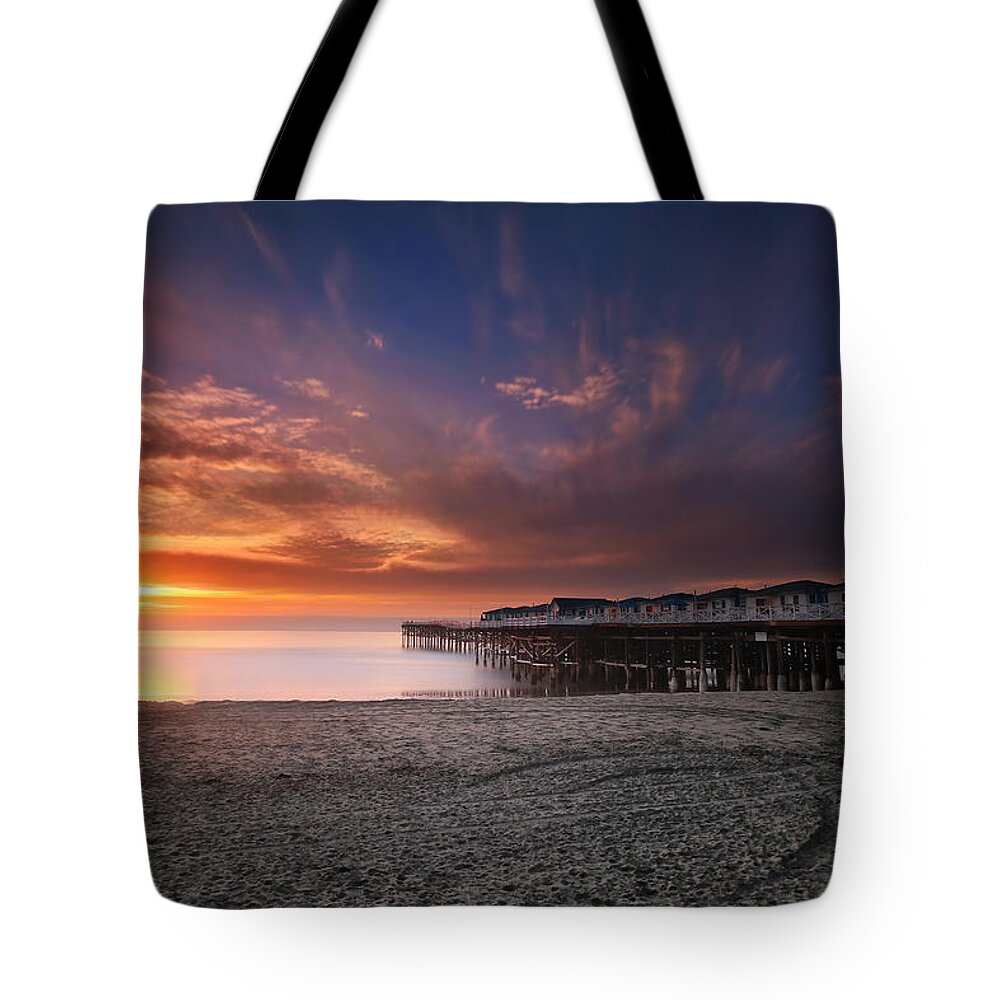 Sunset Tote Bag featuring the photograph The Crystal Pier by Larry Marshall