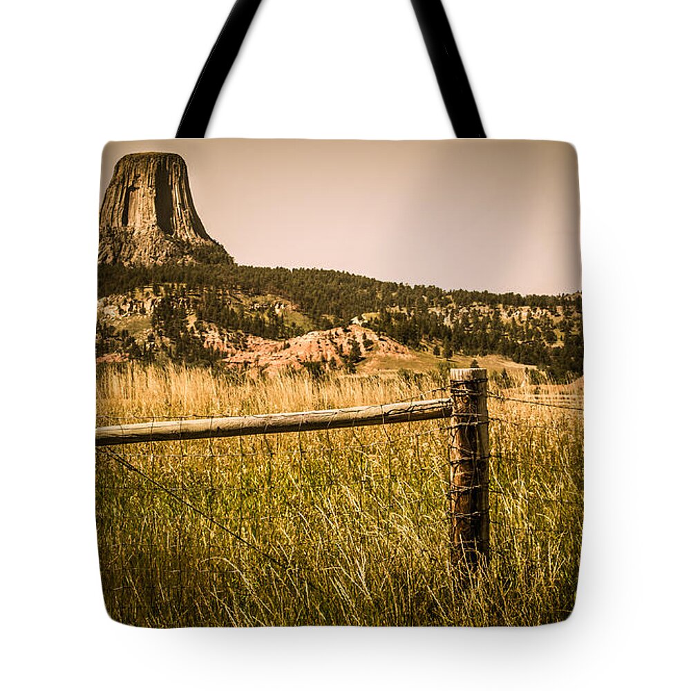 Devils Tower Tote Bag featuring the photograph The Devils Tower by Perry Webster