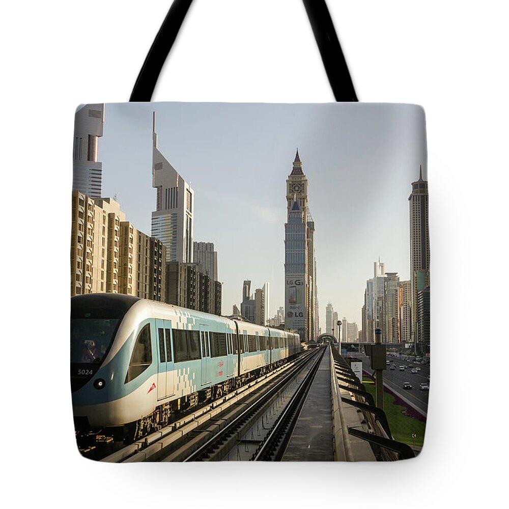 Rail Transportation Tote Bag featuring the photograph The Dubai Metro by Muhammad Owais Khan