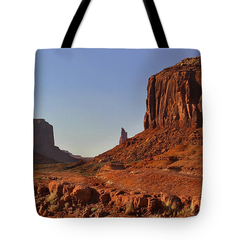 Desert Tote Bag featuring the photograph The Dusty Trail - Monument Valley by Mike McGlothlen