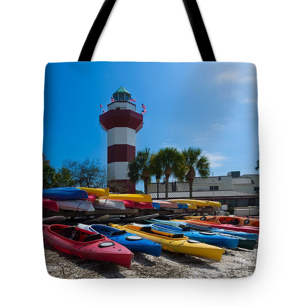 Lighthouse Tote Bag featuring the photograph The famous lighthouse at Harbourtown on Hilton Head Island by Louise Heusinkveld