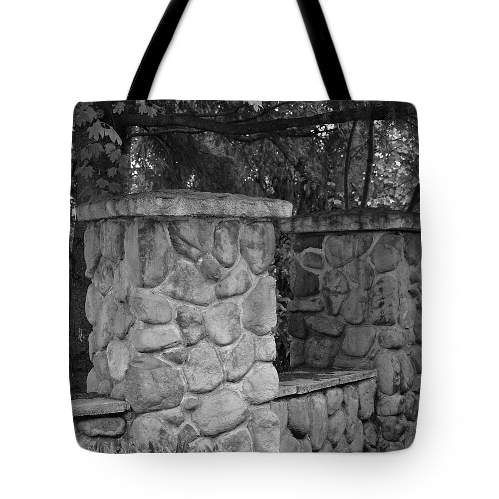 Black And White Tote Bag featuring the photograph The Garden Wall by Kirt Tisdale