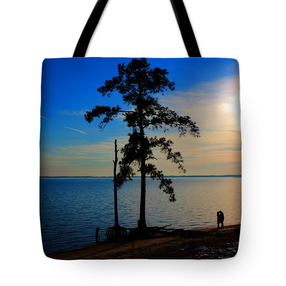 Silhouette Tote Bag featuring the photograph The Kiss by Dan Stone