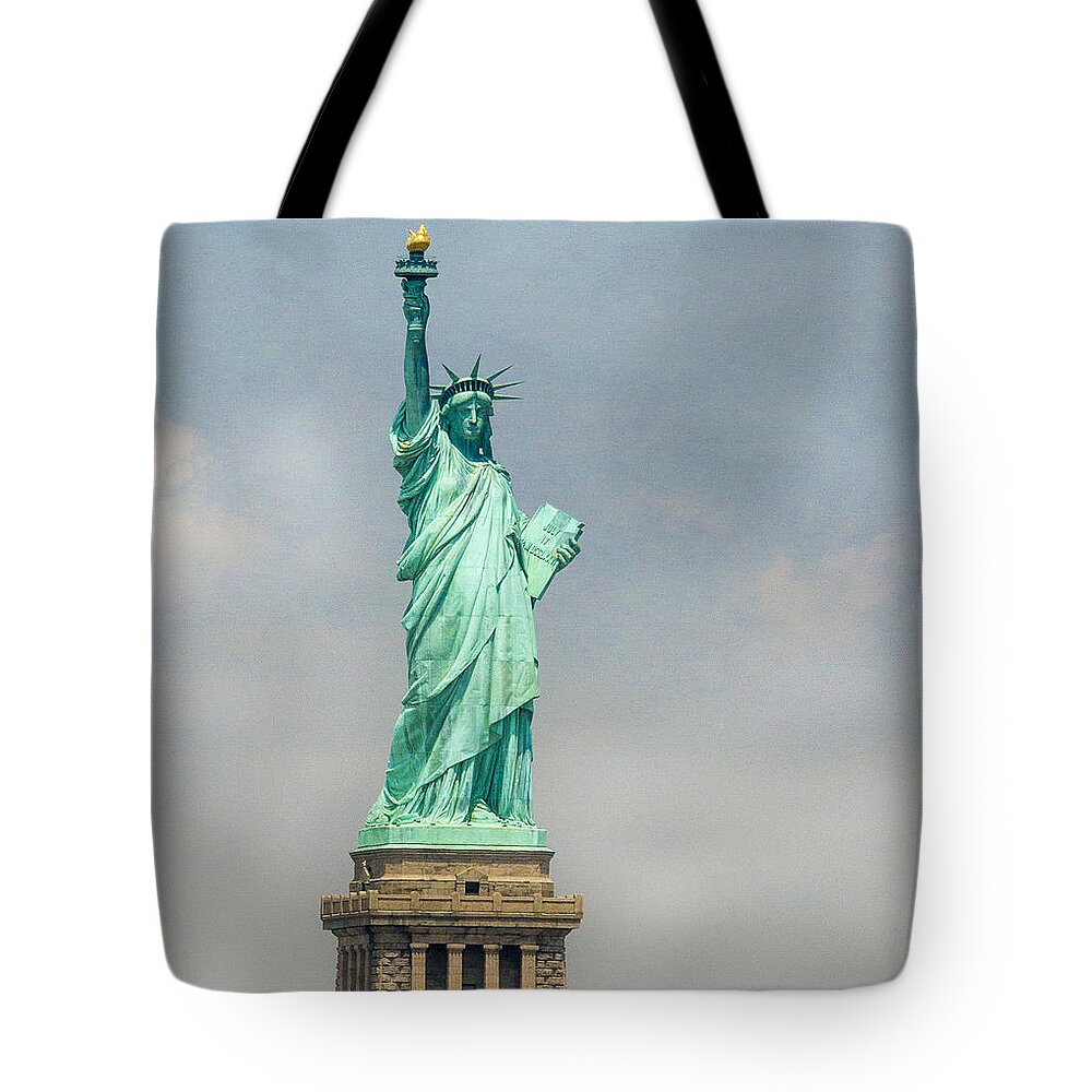 Statue Tote Bag featuring the photograph The Lady by Jean Noren