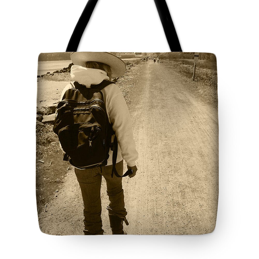Lady Walking On A Long And Dusty Road Tote Bag featuring the photograph The Long And Winding Road by Kym Backland