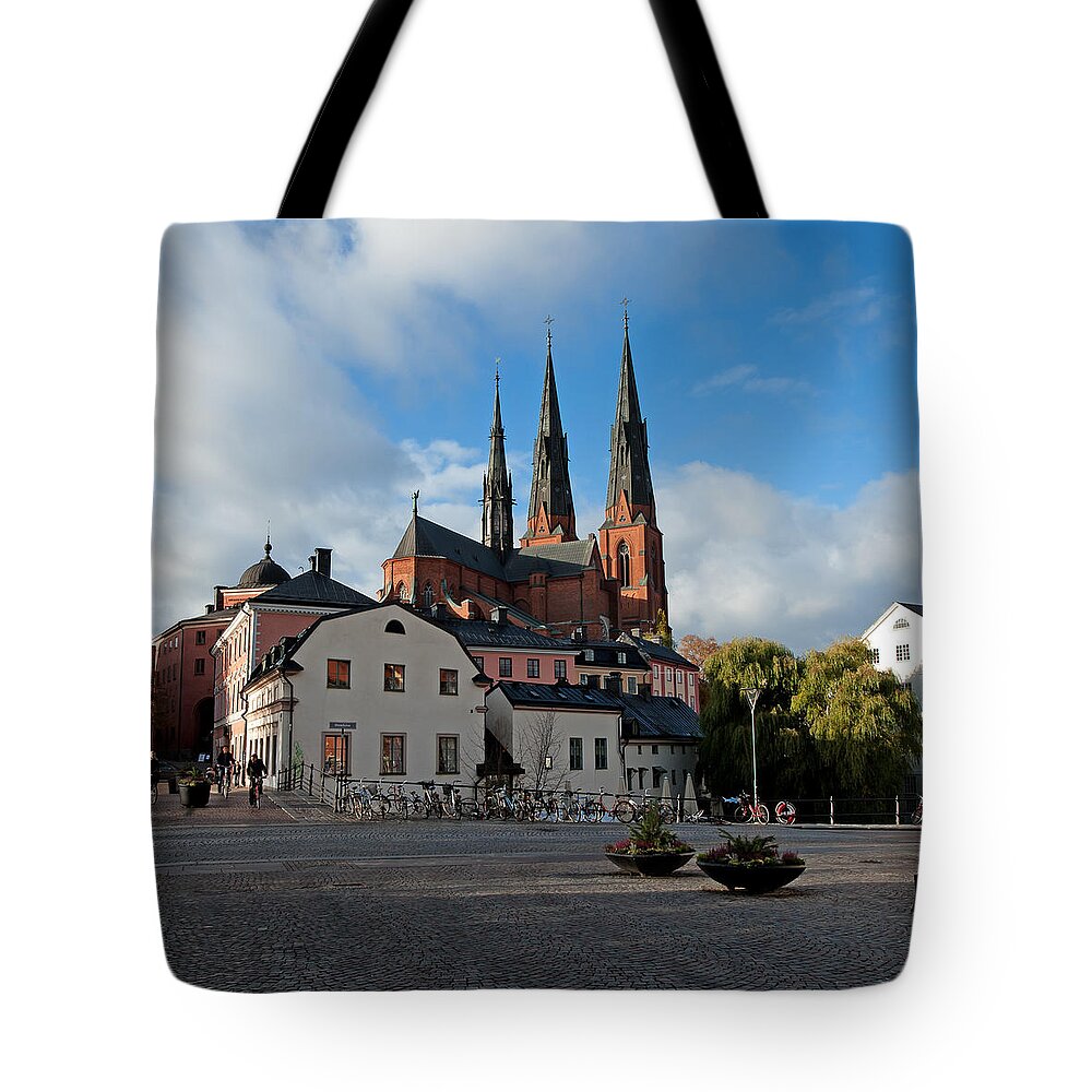 The Medieval Uppsala Tote Bag featuring the photograph The medieval Uppsala by Torbjorn Swenelius