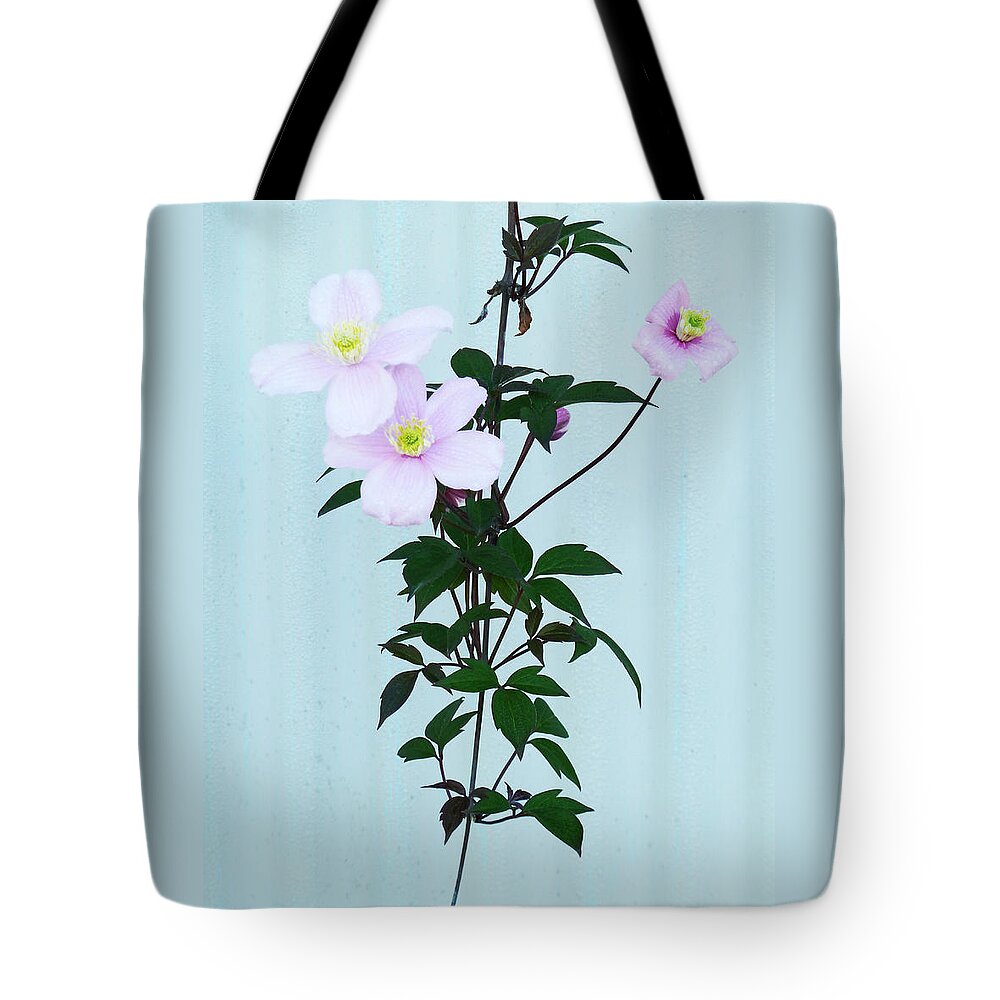 Corrugated Tote Bag featuring the photograph The Pink Clematis by Steve Taylor