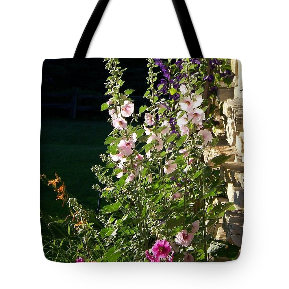Hollyhocks Tote Bag featuring the photograph The Secret Garden by Jackie Mueller-Jones