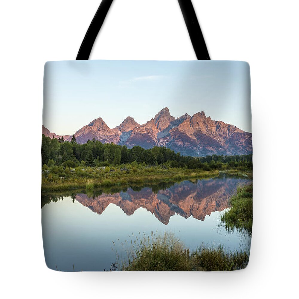 The Tetons Reflected On Schwabachers Landing Grand Teton National Park At Sunrise Tote Bag featuring the photograph The Tetons Reflected On Schwabachers Landing - Grand Teton National Park Wyoming by Brian Harig