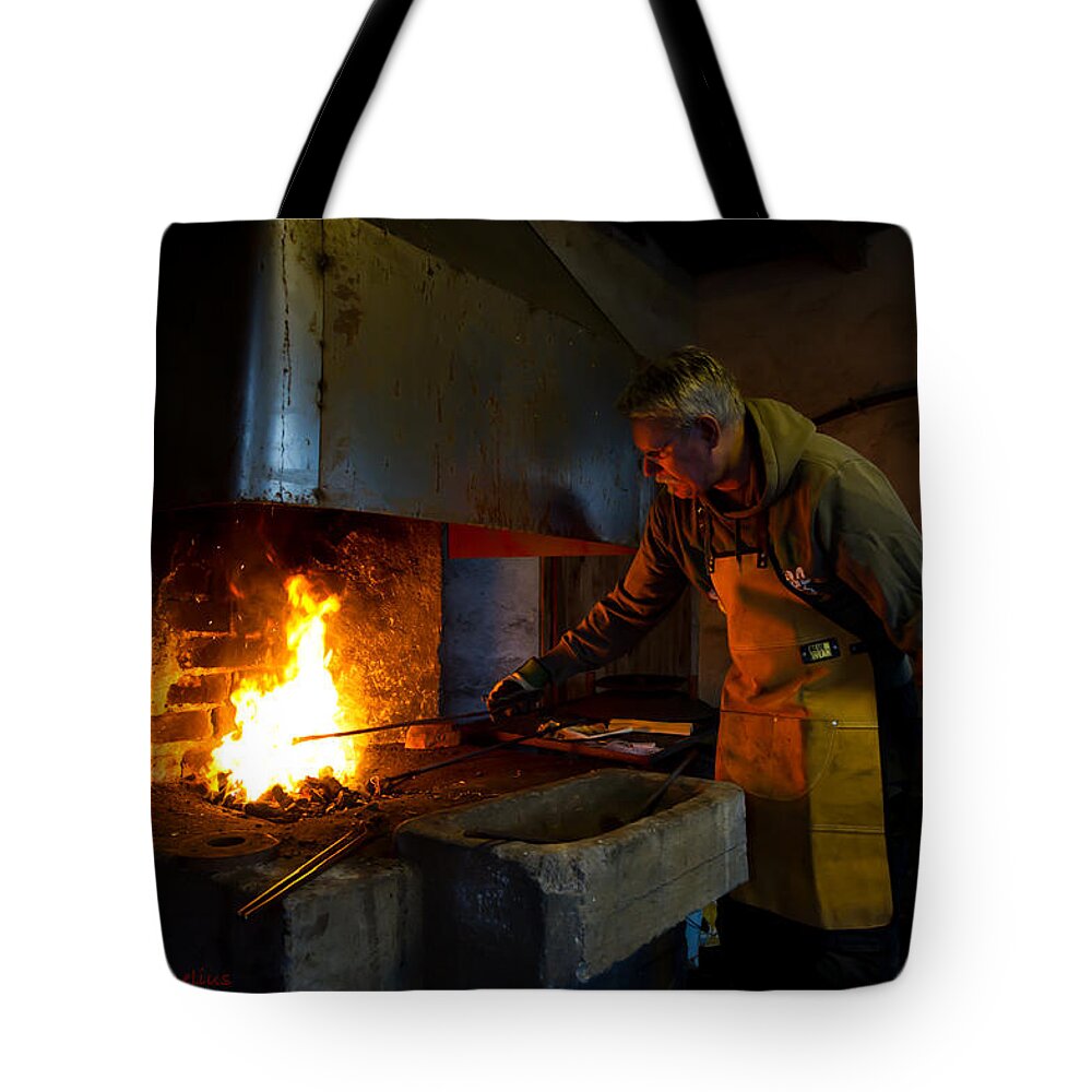 The Torresta Blacksmith Tote Bag featuring the photograph The Torresta Blacksmith by Torbjorn Swenelius