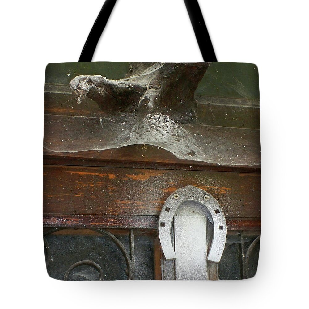 Newel Hunter Tote Bag featuring the photograph Thing above the door by Newel Hunter