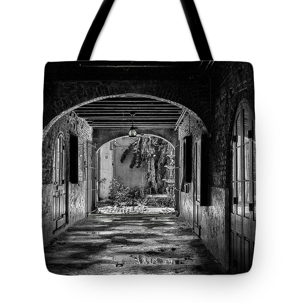Structures Tote Bag featuring the photograph To The Courtyard - BW by Christopher Holmes