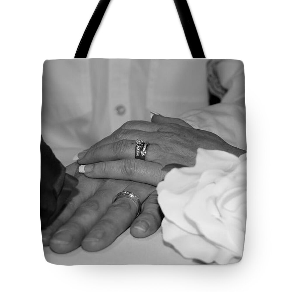 Hands Tote Bag featuring the photograph Together Forever by Davandra Cribbie