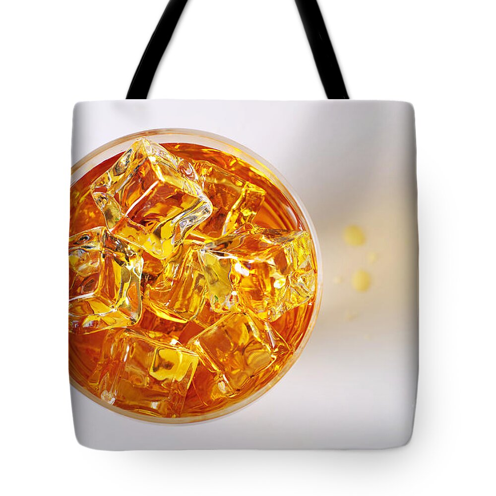 Alcohol Tote Bag featuring the photograph Top view on Drink by Carlos Caetano