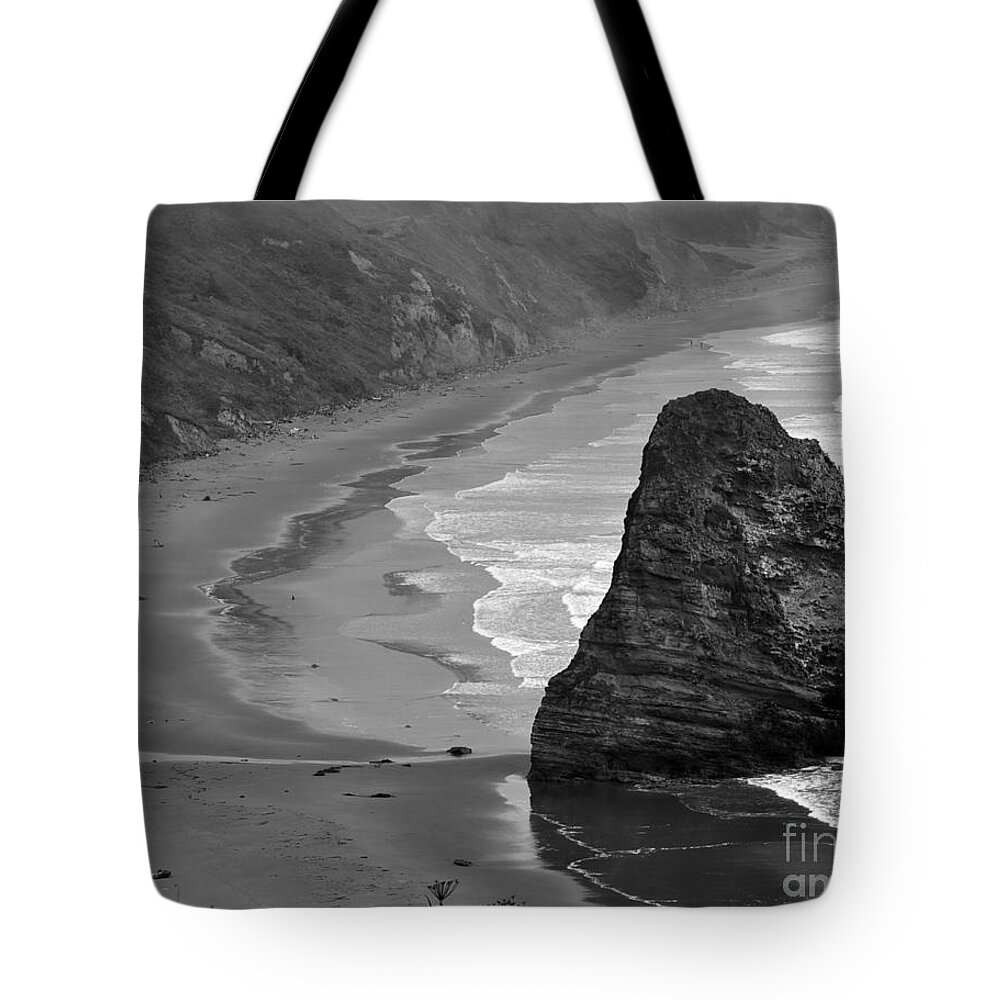 Beach Photographs Tote Bag featuring the photograph Towering Rock by Kirt Tisdale