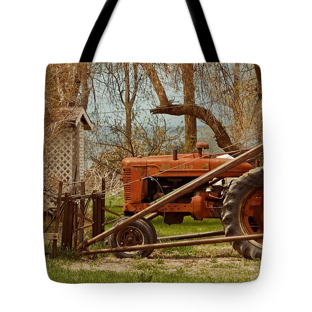 Tractor Tote Bag featuring the photograph Tractor on US 285 by Bryant Coffey