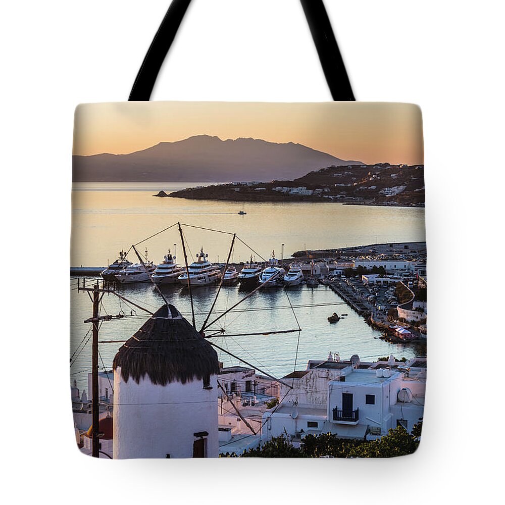 Motorboat Tote Bag featuring the photograph Traditional Greek Windmill In Mykonos by Deimagine