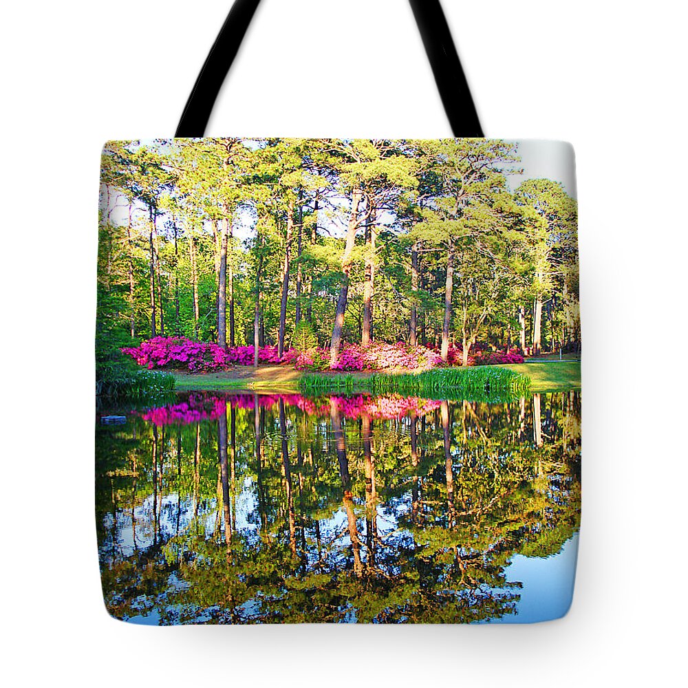 Trees Tote Bag featuring the photograph Tree Reflections and Pink Flowers by the Blue Water by Jan Marvin Studios by Jan Marvin