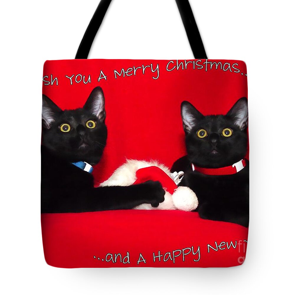 Black Tote Bag featuring the photograph two black cats Christmas by Peggy Hughes