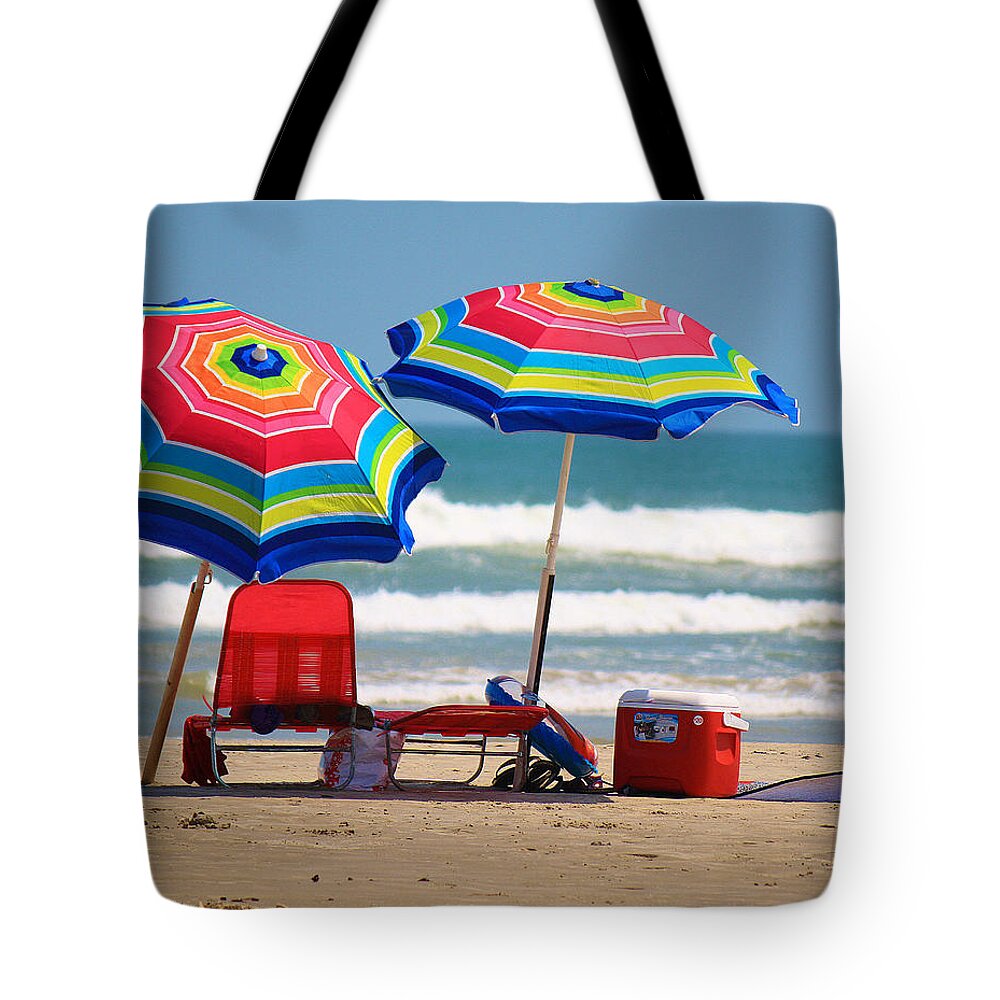Roena King Tote Bag featuring the photograph Two Umbrellas on the Beach in Texas by Roena King
