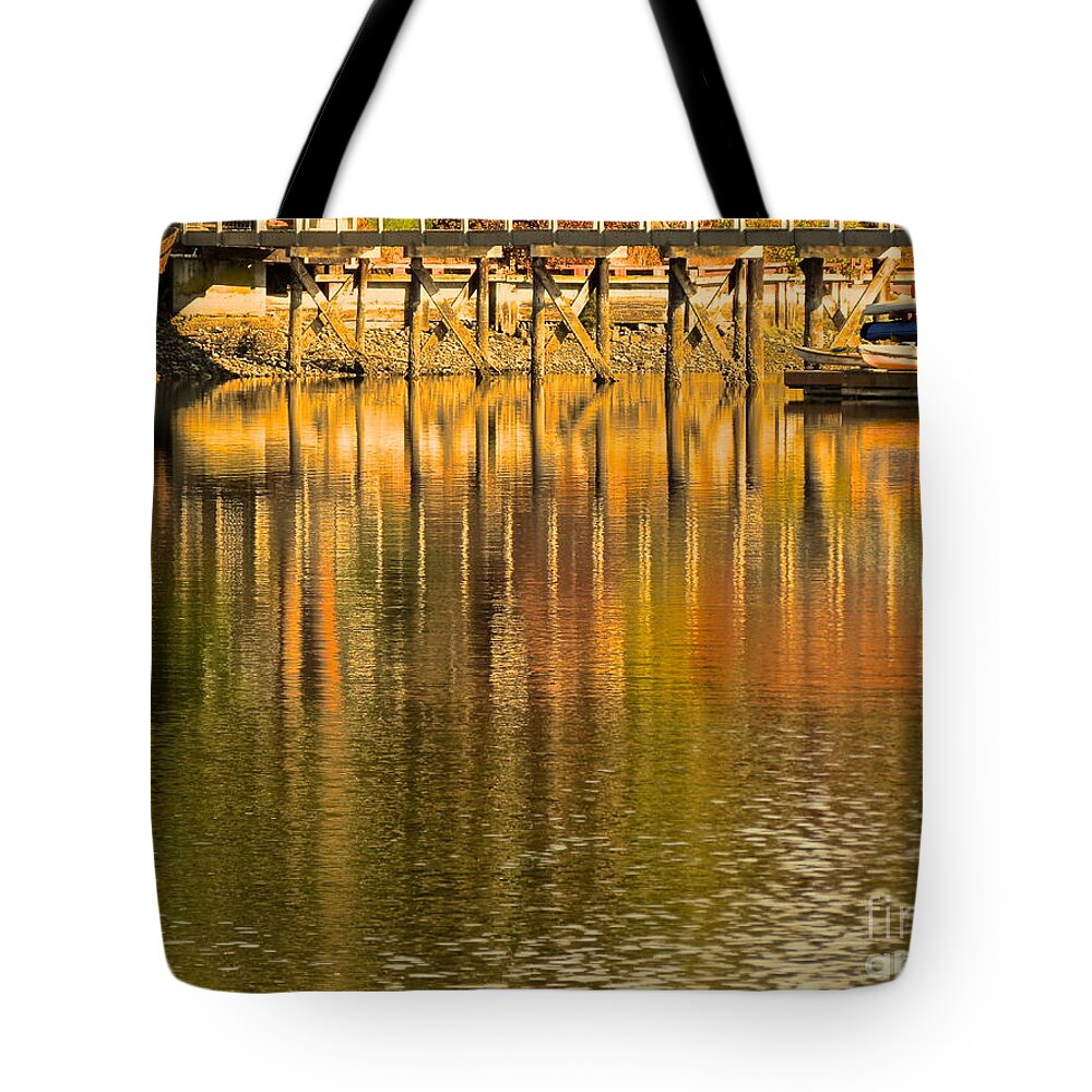 Boat Tote Bag featuring the photograph Under the dock by LeLa Becker