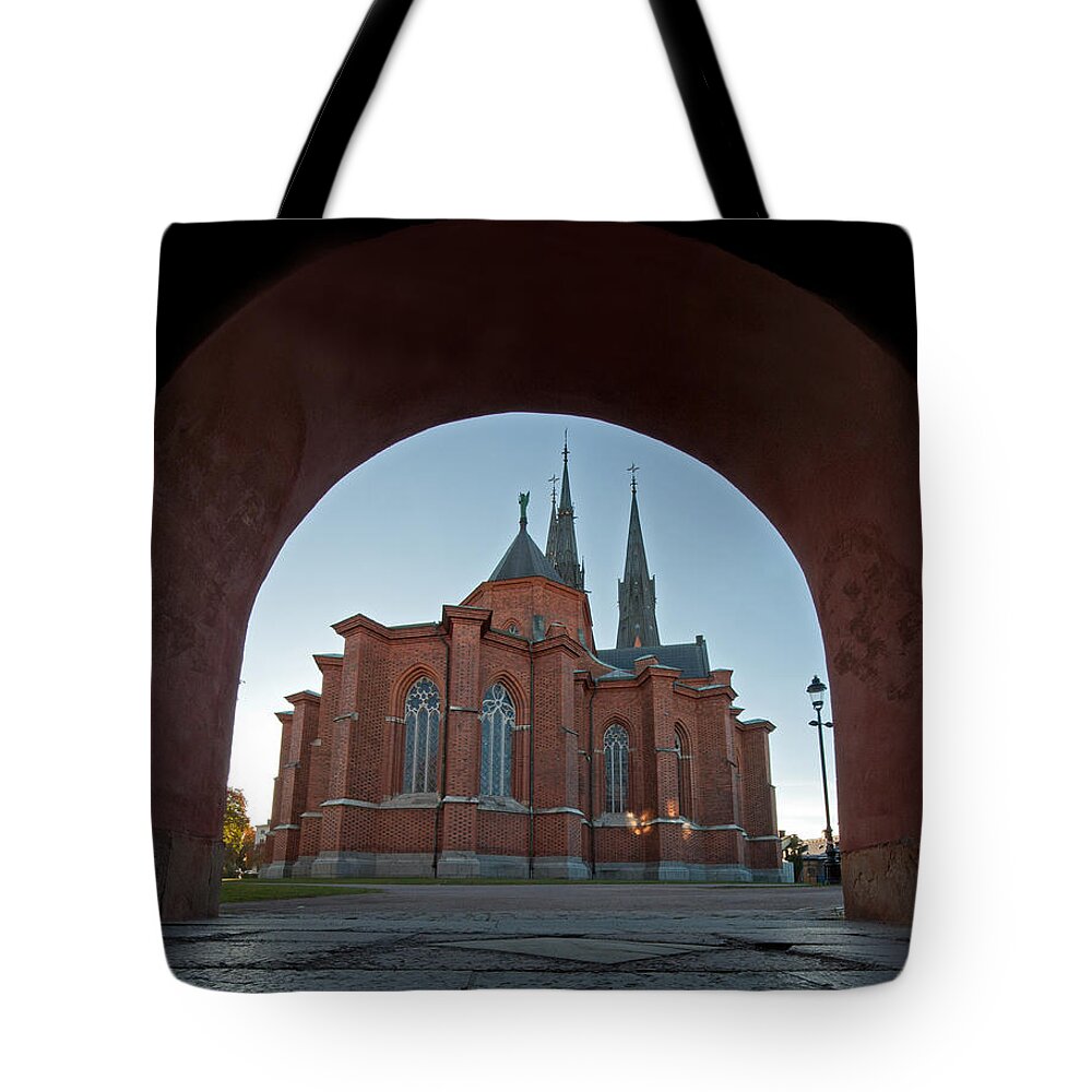 Uppsala Cathedral's East Side Tote Bag featuring the photograph Uppsala Cathedral's east side by Torbjorn Swenelius