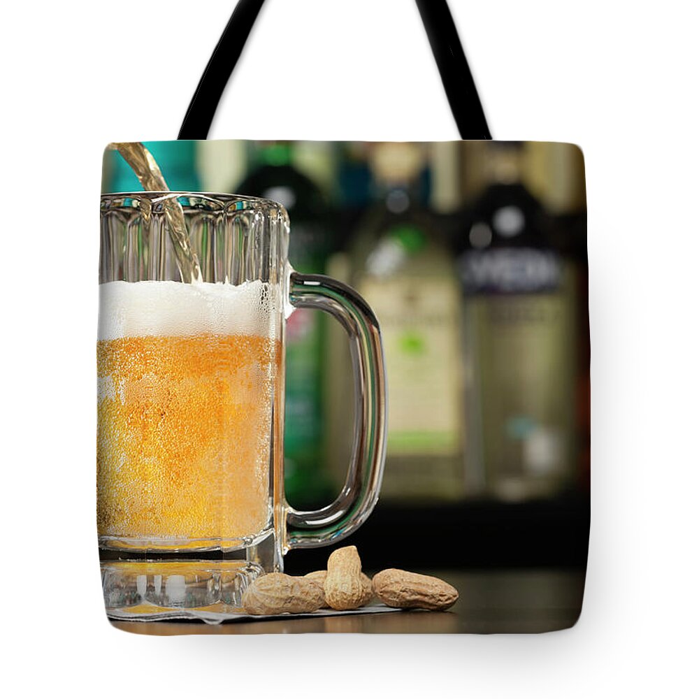 Nut Tote Bag featuring the photograph Usa, Illinois, Metamora, Pouring Lager by Vstock Llc