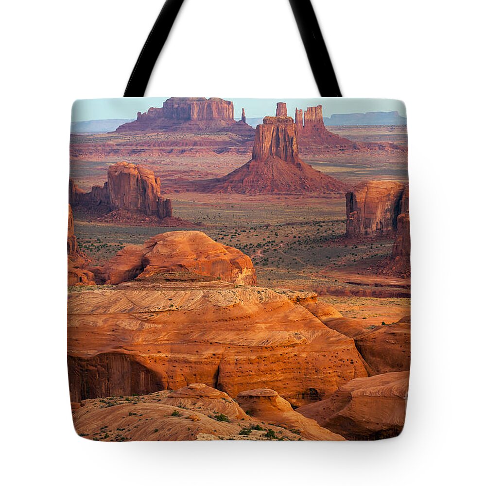 Monument Valley Tote Bag featuring the photograph Valley of Monuments at Dawn by Bob Phillips