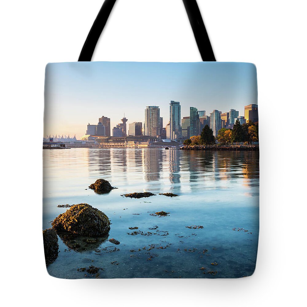 Clear Sky Tote Bag featuring the photograph Vancouver Skyline At Stanley Park by Wan Ru Chen