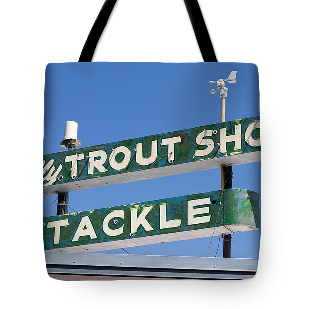 Sign Tote Bag featuring the photograph Vintage Trout Shop Sign West Yellowstone by Edward Fielding