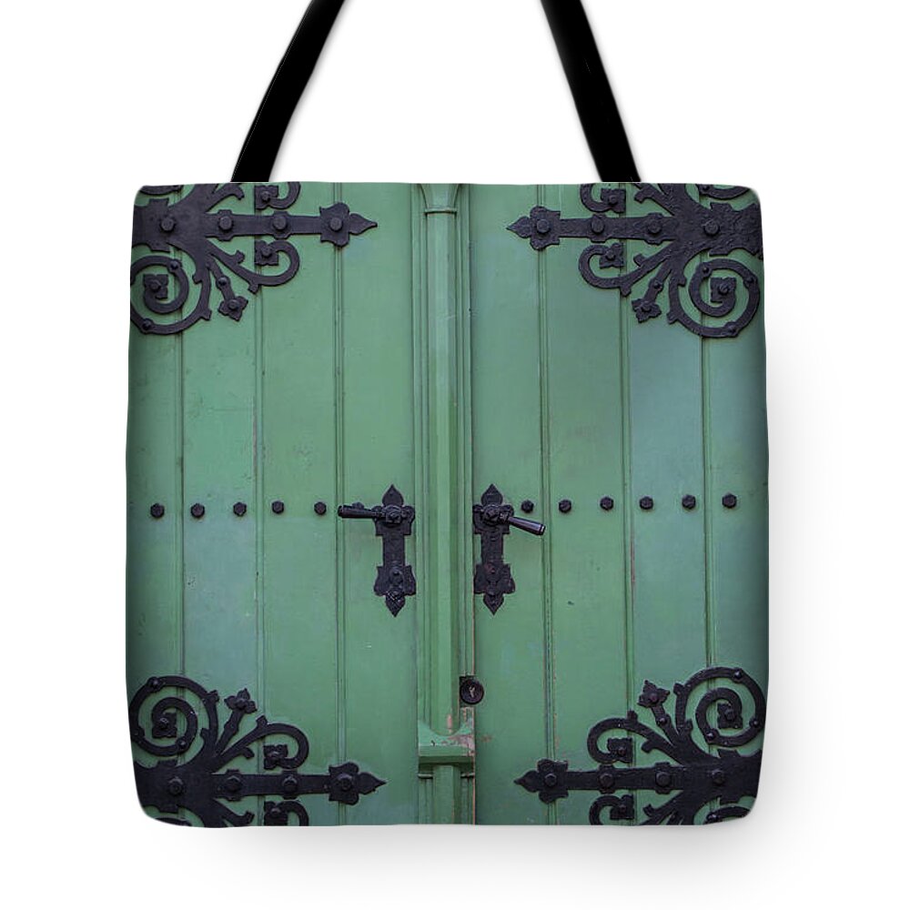 Arch Tote Bag featuring the photograph Vintage Wooden Green Door Close-up by Bogdan Khmelnytskyi