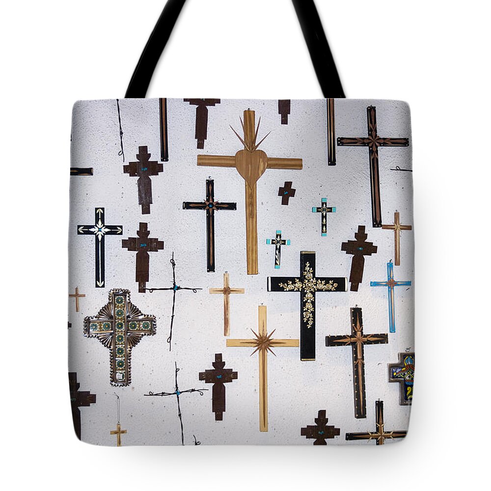 Crucifxes Tote Bag featuring the photograph Wall of Crosses by John Greco