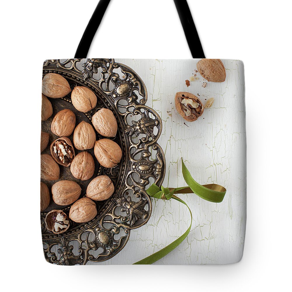 Newtown Tote Bag featuring the photograph Walnuts by Yelena Strokin