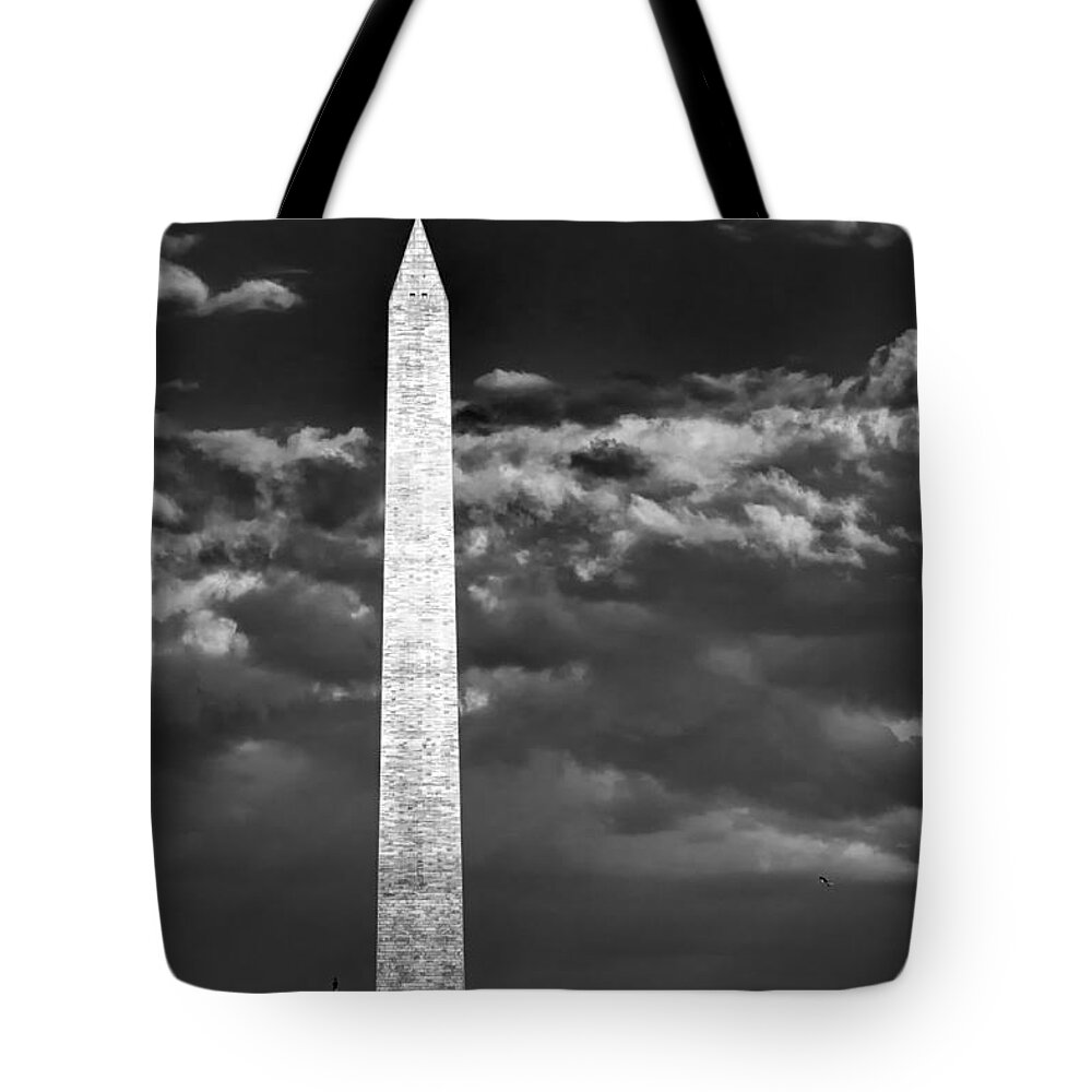 Washington Dc Tote Bag featuring the photograph Washington Monument in cloudy sky by Izet Kapetanovic