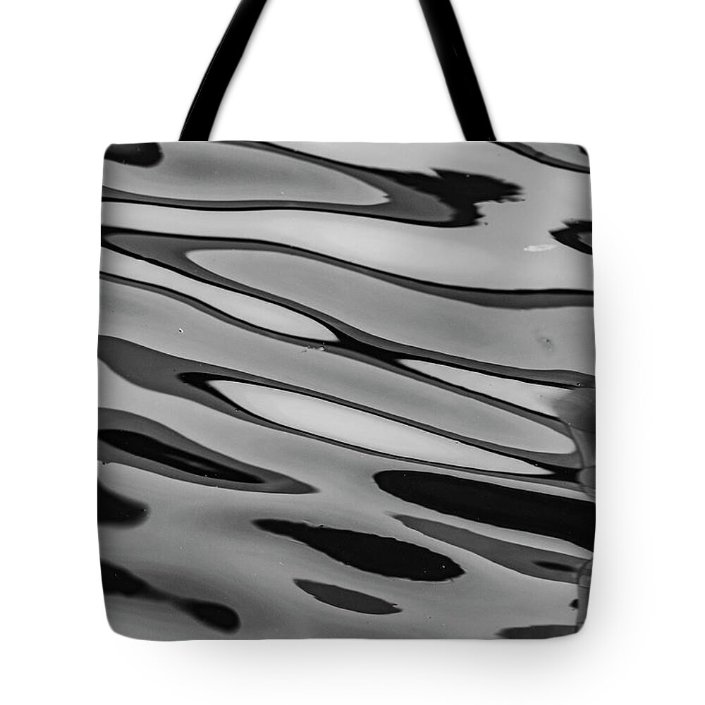 Sparse Tote Bag featuring the photograph Water Ripples by Mraust