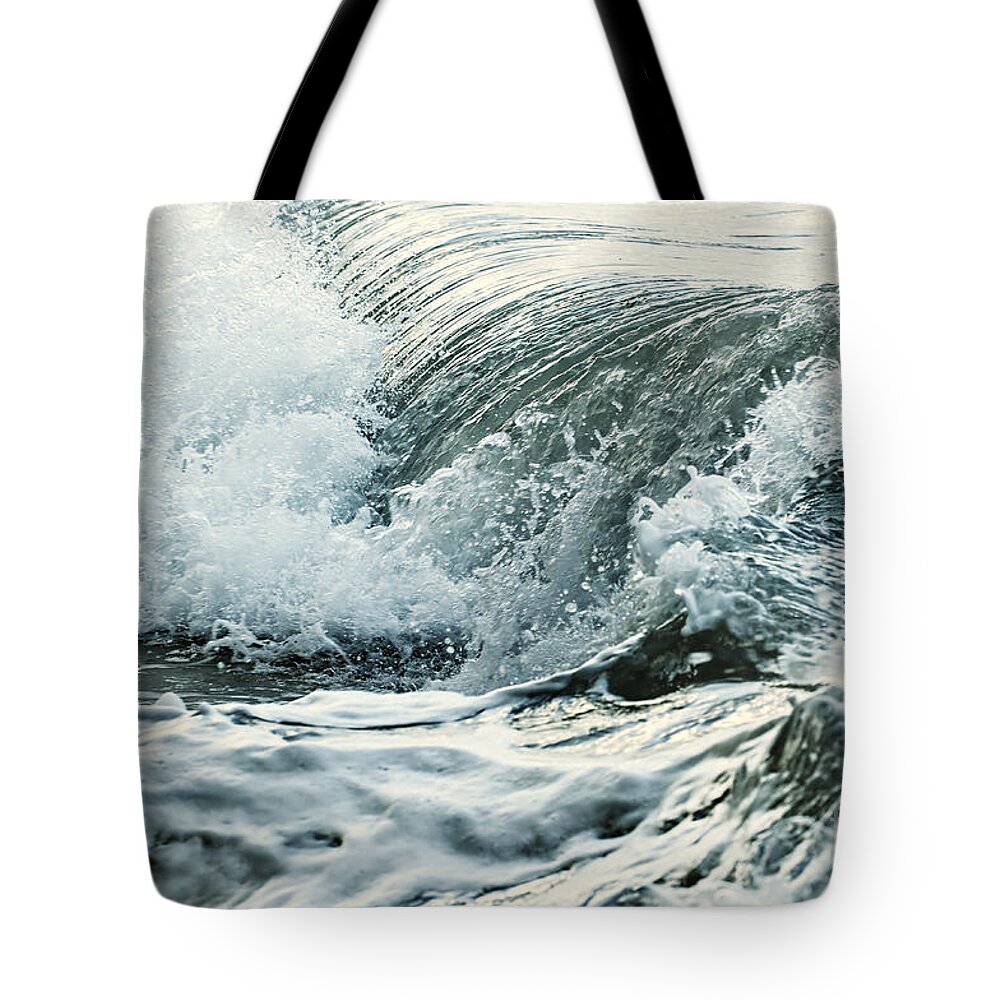Wave Tote Bag featuring the photograph Waves in stormy ocean by Elena Elisseeva