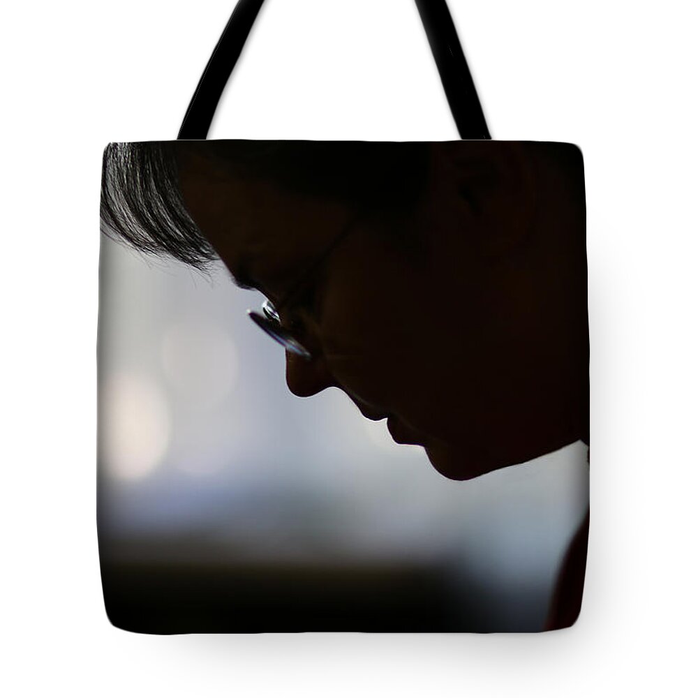 Woman Tote Bag featuring the photograph When She Prays by Mark McKinney
