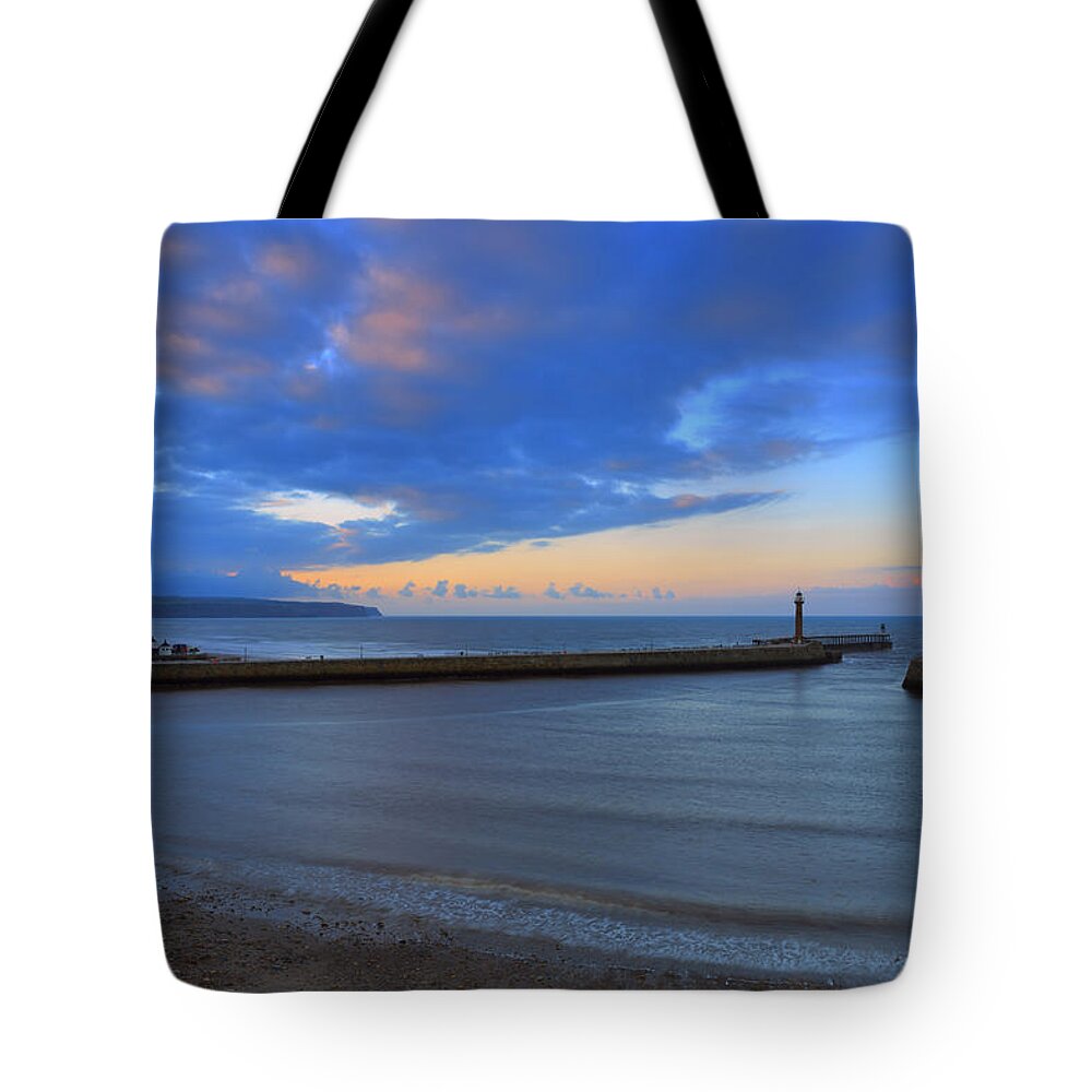 Water's Edge Tote Bag featuring the photograph Whitby Harbour Entrance At Sunset by Louise Heusinkveld