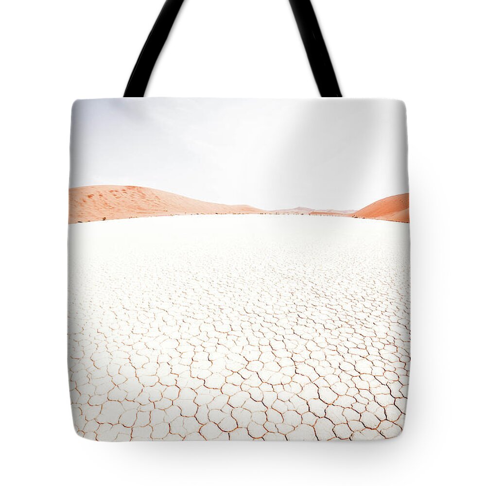 Tranquility Tote Bag featuring the photograph White Clay Pan And Dunes by Taken By Chrbhm