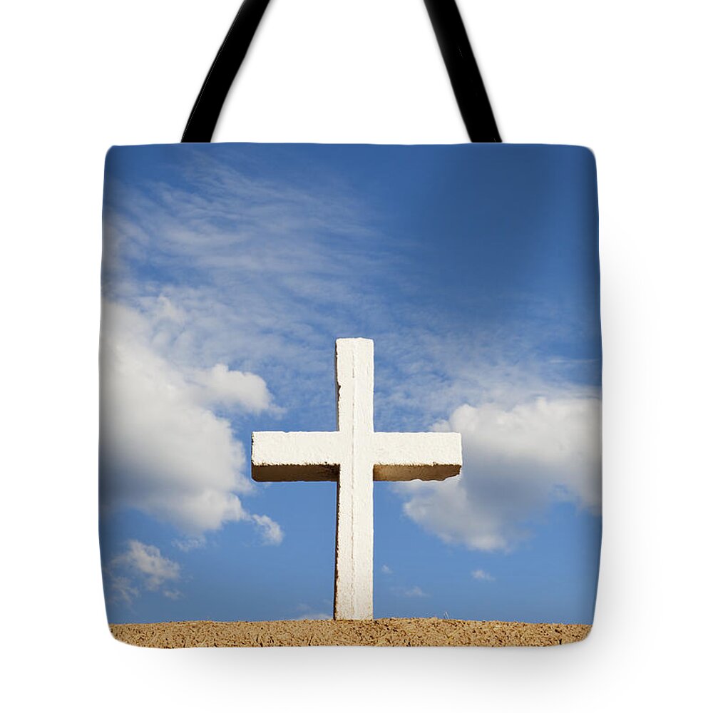 Cross Tote Bag featuring the photograph White Cross on Adobe Wall by Bryan Mullennix