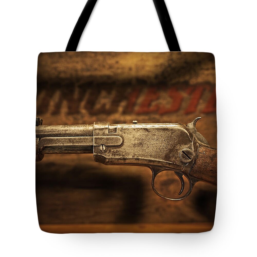 Winchester Tote Bag featuring the photograph Winchester by John Anderson