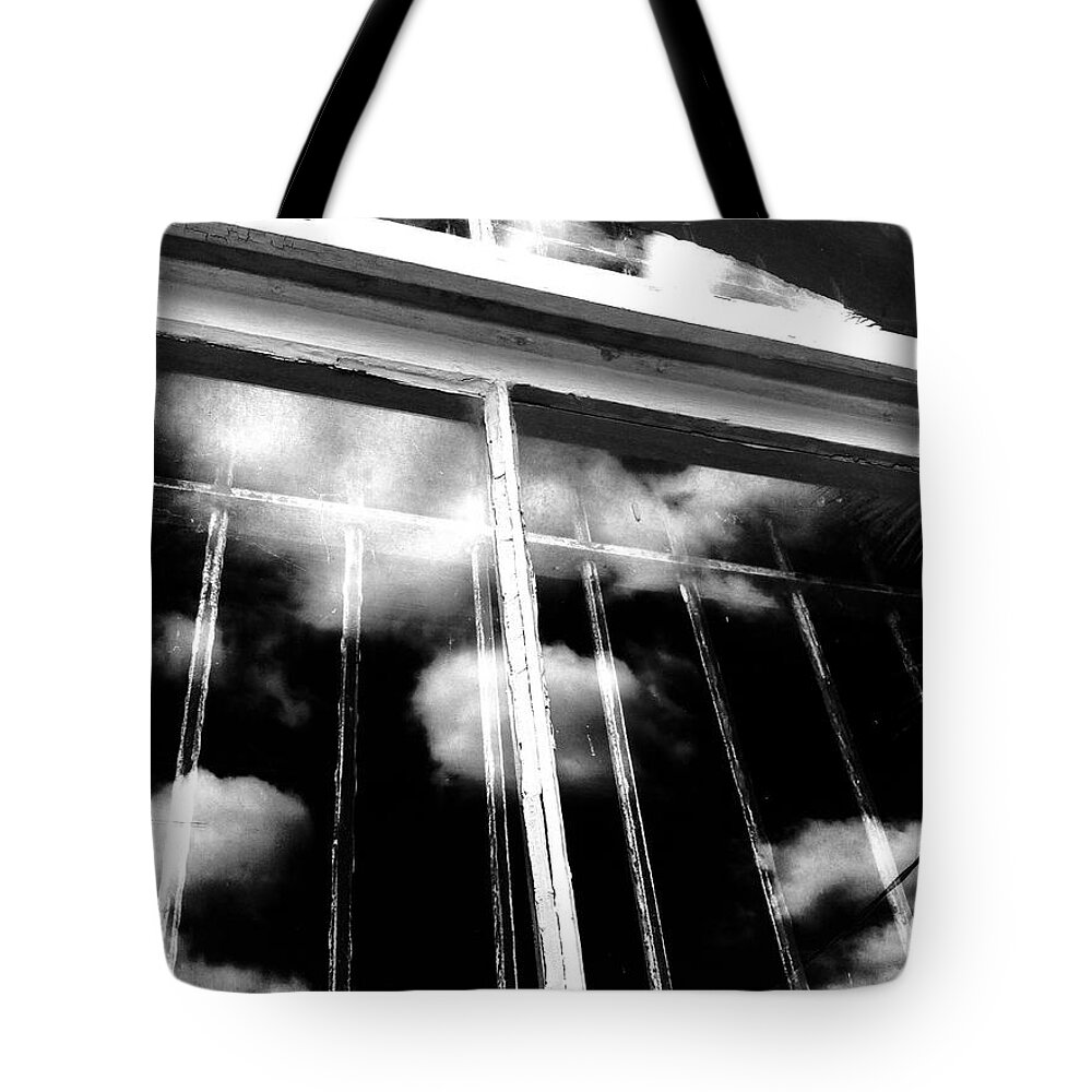 Window Cloud Tote Bag featuring the photograph Window clouds by WaLdEmAr BoRrErO