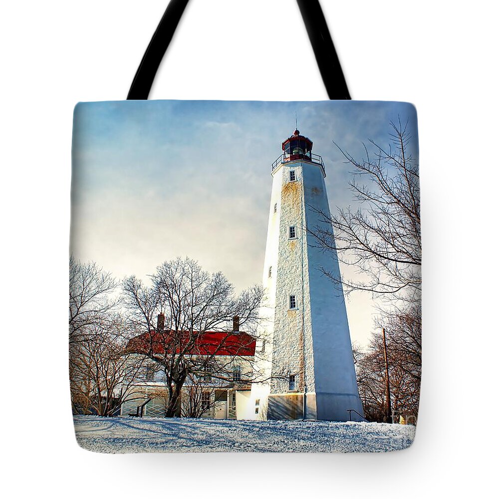 Architecture Tote Bag featuring the photograph Winter at Sandy Hook Light by Nick Zelinsky Jr